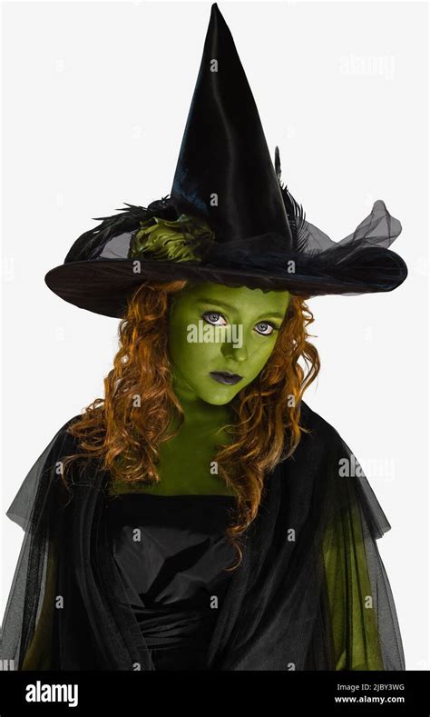 Portrait Of A Woman Dressed As A Witch With Green Body Paint Looking