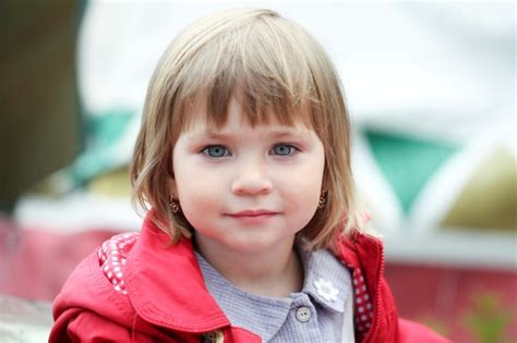 Premium Photo Baby Girl In Red Caucasian Blonde Real People Girl Close Portrait Outdoor