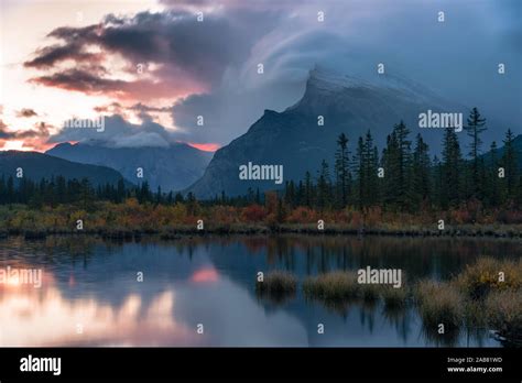 Sunrise And Storm Clouds At Vermillion Lakes With Mount Rundle In