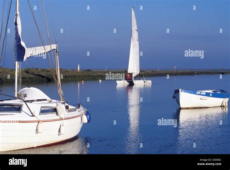 Boats On Still River Stock Photo Alamy