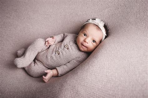 Premium Photo | Newborn baby girl posing and smiling