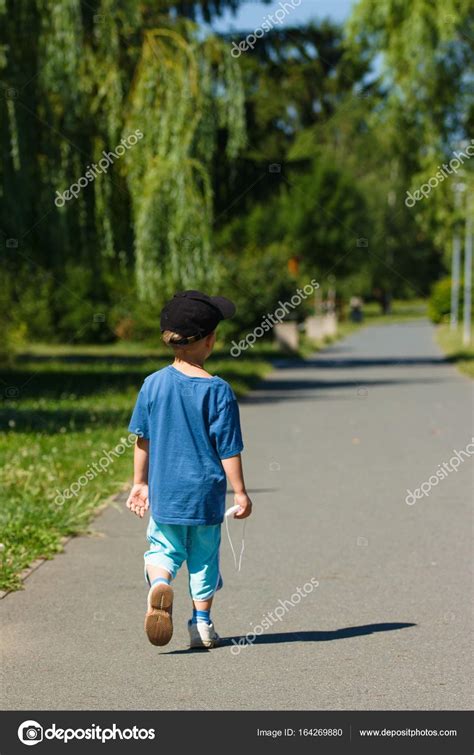 Child walking in park on sunny summer day — Stock Photo © iseinor ...