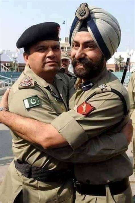 Indian Border Security Force officer and Pakistan Ranger embrace each ...