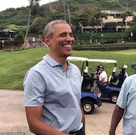 Shirtless Barack Obama is pictured paddleboarding in Hawaii - ReadSector