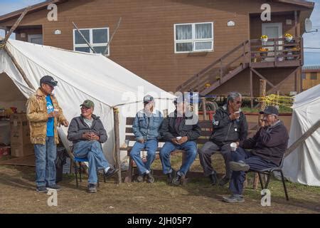 indigenous dene elder men sitting  prophet ayahs house