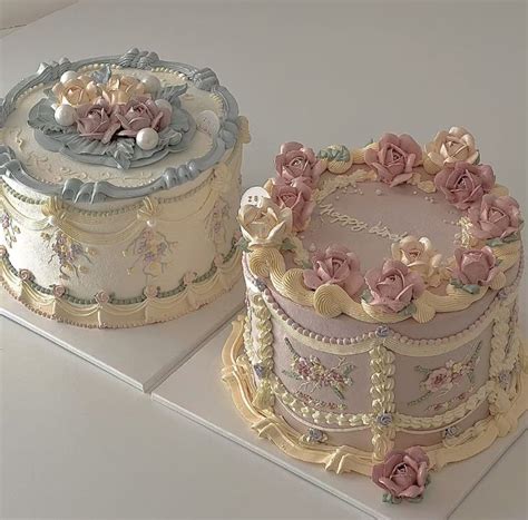 Two Cakes Decorated With Flowers And Pearls On Top Of Each Other One