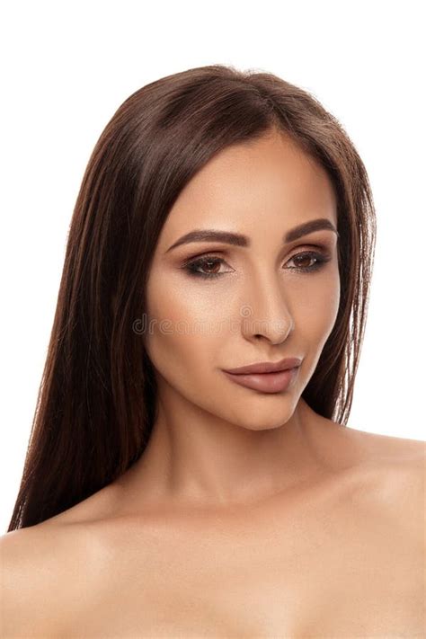 Close Up Portrait Of A Brunette Nude Model Girl With Professional Evening Make Up And Plump Lips