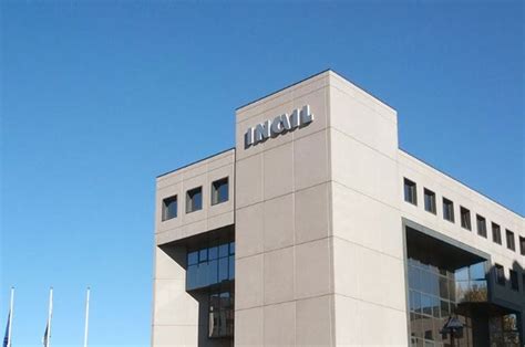 A Tall Building Sitting Next To A Parking Lot