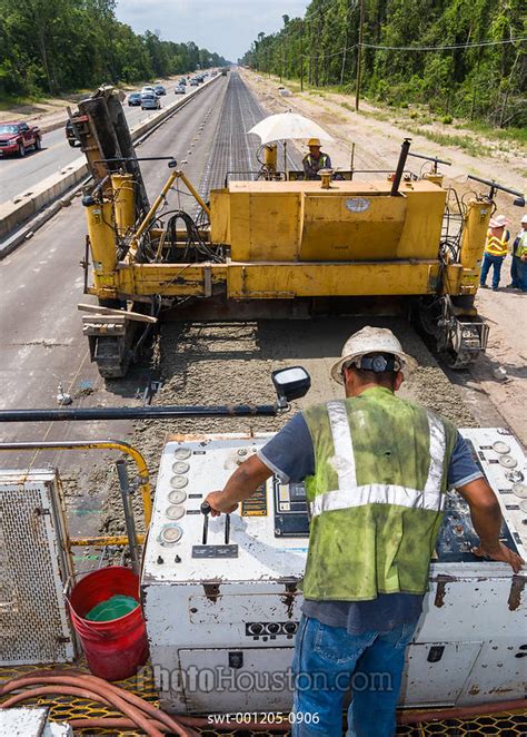 Photo Houston | Highway construction workers smoothing freshly poured ...