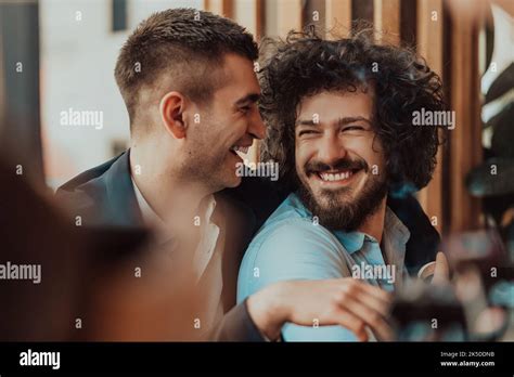 Portrait Of Multiethnic Diverse Gay LGBT Romantic Male Couple Embracing And Showing Their Love