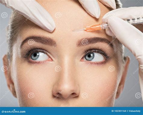 Woman Getting Cosmetic Botox Injection in Forehead Stock Photo - Image of aesthetic, hyaluronic ...