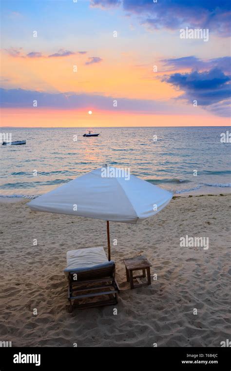 Sunset over Madagascar Nosy be beach with sunlounger Stock Photo - Alamy