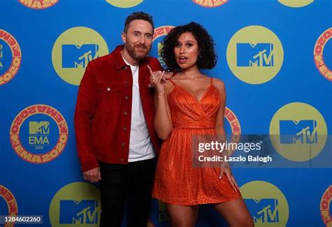 In this image released on November 08, David Guetta and Raye pose