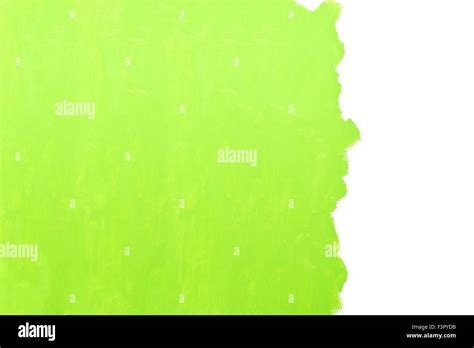 Painting a wall using a roller with green paint Stock Photo - Alamy