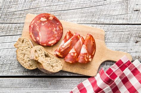 Premium Photo Sliced Chorizo Salami Sausage On Cutting Board