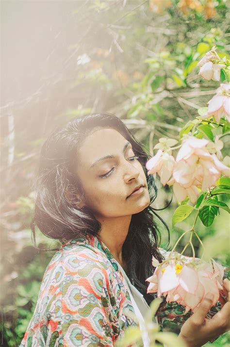 "Beautiful Indian Woman By Pink Flowers" by Stocksy Contributor ...