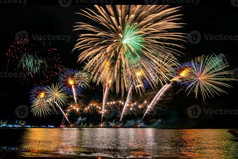 Amazing Beautiful Colorful Fireworks Display On Celebration Night Showing On The Sea Beach With