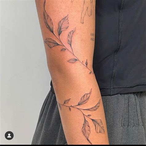 Elegant Floral Arm Cuff Tattoo