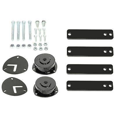 an assortment of hardware and mountings for the front end of a car, including two brackets