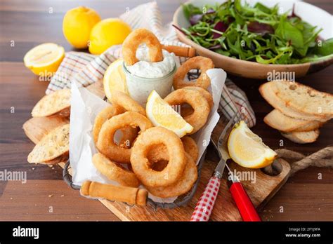 Crispy breaded calamari rings Stock Photo - Alamy