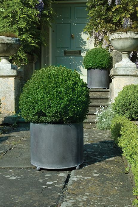 Create instant vibrancy with large metal garden planters - Garden Requisites