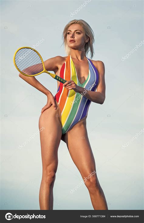 Sexy Legs Girl In Bikini On Beach With Racket Sportswoman Sexy Woman In Striped Swimsuit