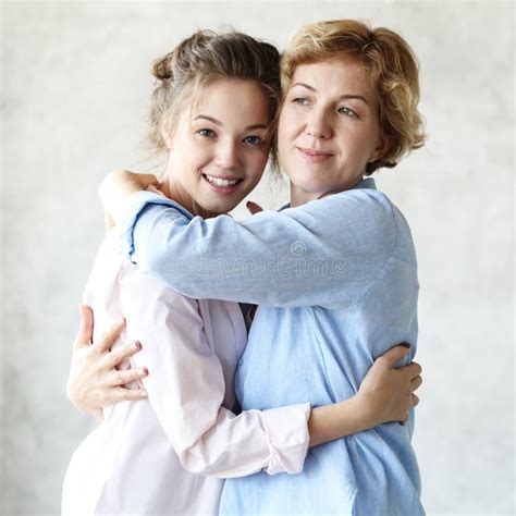 Lifestyle And People Concept Happy Senior Mother Embracing Adult