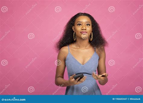 Beautiful Young African Woman Using Her Mobile Phone Stock Image