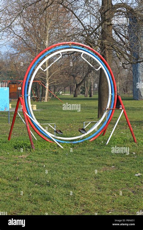 Rotating Human Gyroscope 3D Space Rings in Park Stock Photo - Alamy