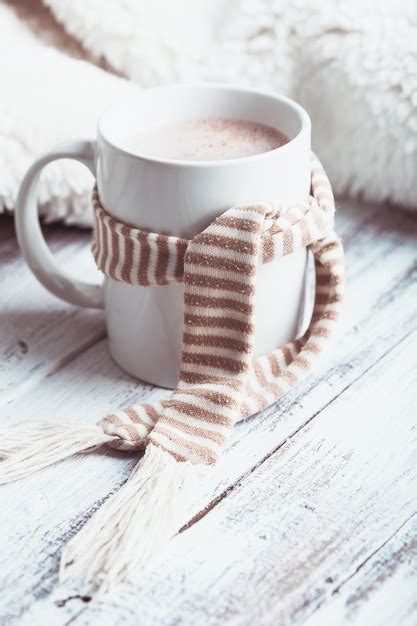 Premium Photo Warming Drink Cup Of Cocoa With Milk On The Table