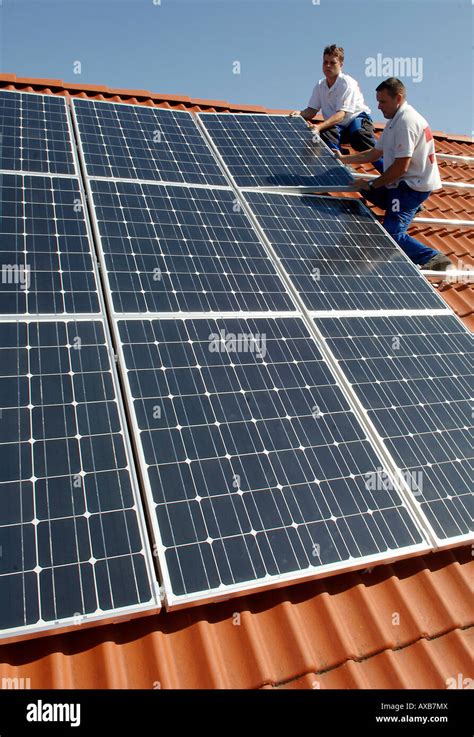 installation  solar panels   roof stock photo alamy