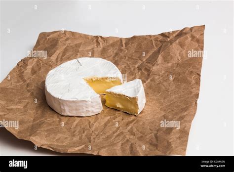 Fresh Slice Camembert Cheese Natural On Kraft Paper Brown Background