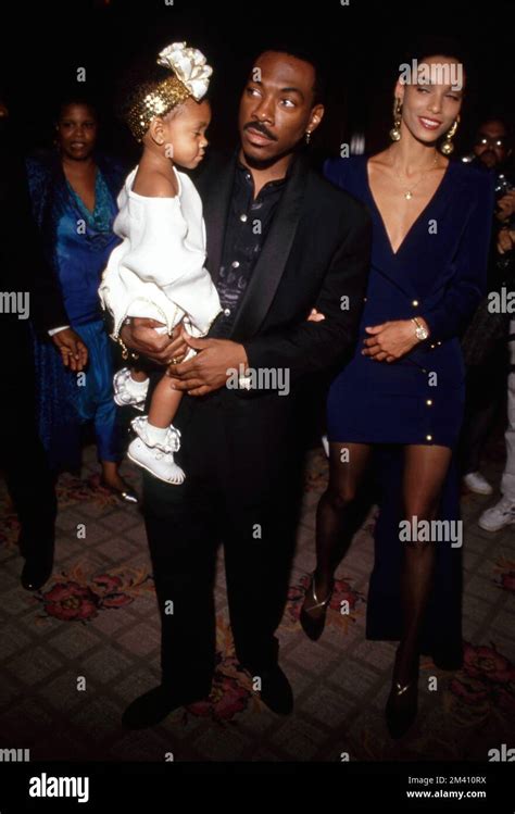 Eddie Murphy with daughter Brea and Nicole Mitchell at the NAACP Salute