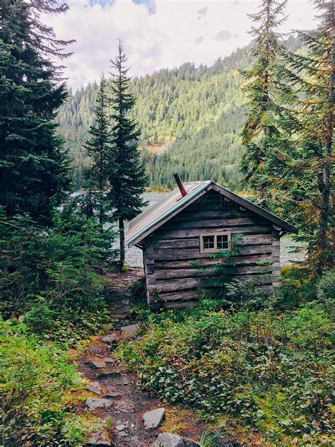 "Hidden Forest Cabin At Edge Of Mountain Lake" by Stocksy Contributor ...