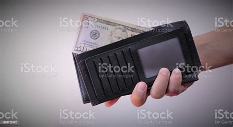 Hand S Holding Black Leather Wallet With Us Dollar Banknote And Euro