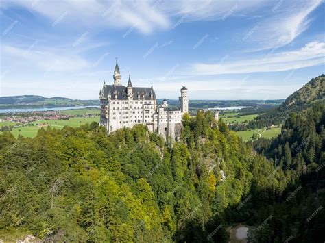 Premium Photo | Neuschwanstein castle from the bridge looks magically ...