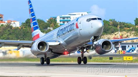 An Airplane That Is Taking Off From The Runway