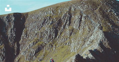 Person sitting on rock mountain during daytime photo – Free Lake district Image on Unsplash