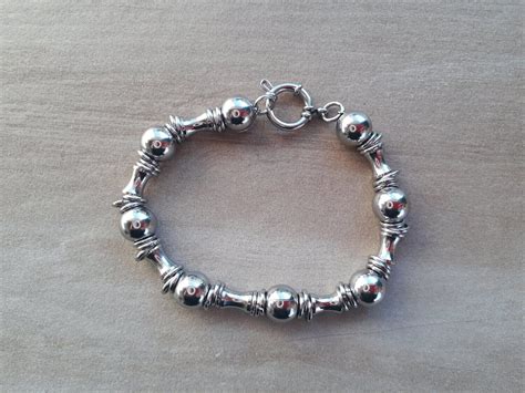 PULSERA DE ACERO TAMBORES Y BOLITAS DE 10 MM LARGO 20 CM Zona Once