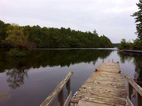 Old Dock Calm Lake Photograph By Susan Janus Fine Art America