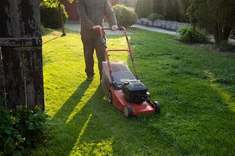 Premium Photo Lawn Mover On Green Grass Machine For Cutting Lawns