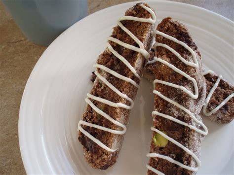 Two Pieces Of Bread With Icing On A White Plate