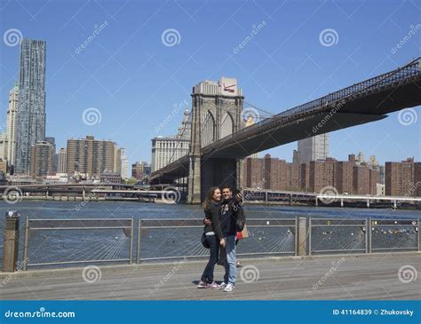 Young Couple Taking Selfie In The Front Of Brooklyn Bridge Editorial