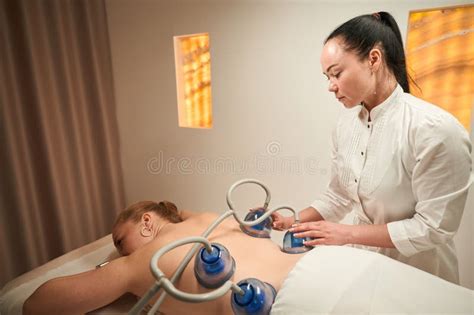 Naked Woman Lies On Massage Table With Her Back Up Stock Image Image