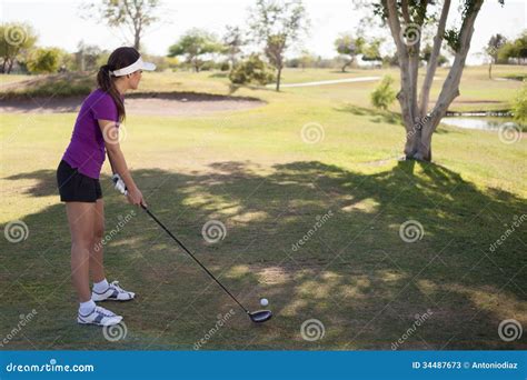 Female Golfer Ready To Swing Stock Image - Image of sunny, professional ...