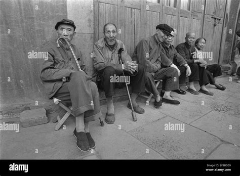 Street Scene In Shanghai Old Chinese People Sitting On A Bench 0206