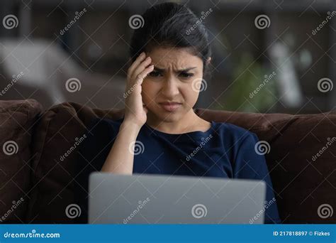 Close Up Unhappy Indian Woman Looking At Laptop Screen Stock Image