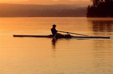 Person Rowing Sculling Boat On River By Pete Saloutos