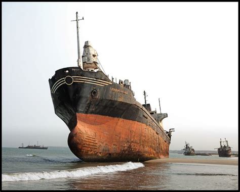 Two Large Ships In The Water Near Each Other