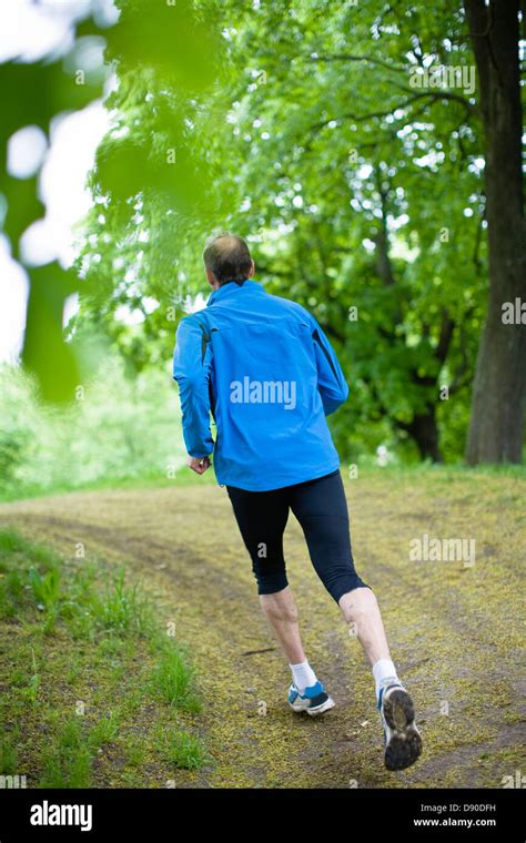 Man Jogging In Park Stock Photo Alamy